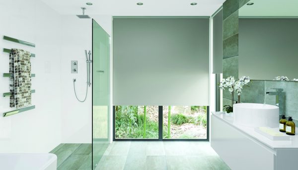 A tranquil bathroom with roller Blind made using ExLite fabric in Slate - Blinds Norfolk - Norwich Sunblinds